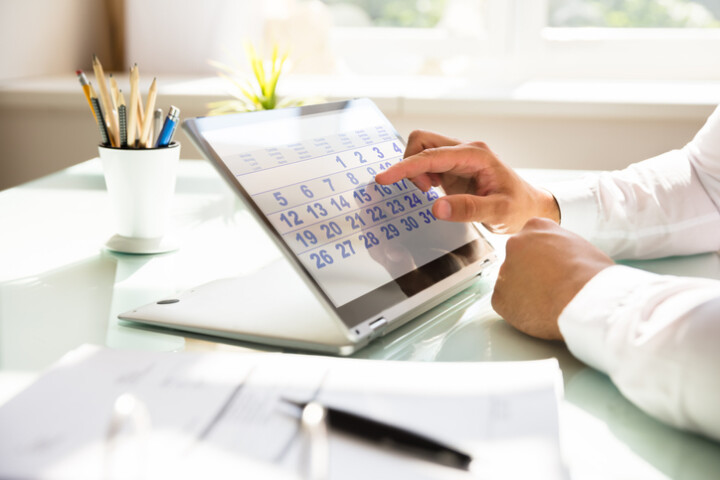 Businessman-using-calendar-to-schedule-iStock-1000963816-uai-720x480